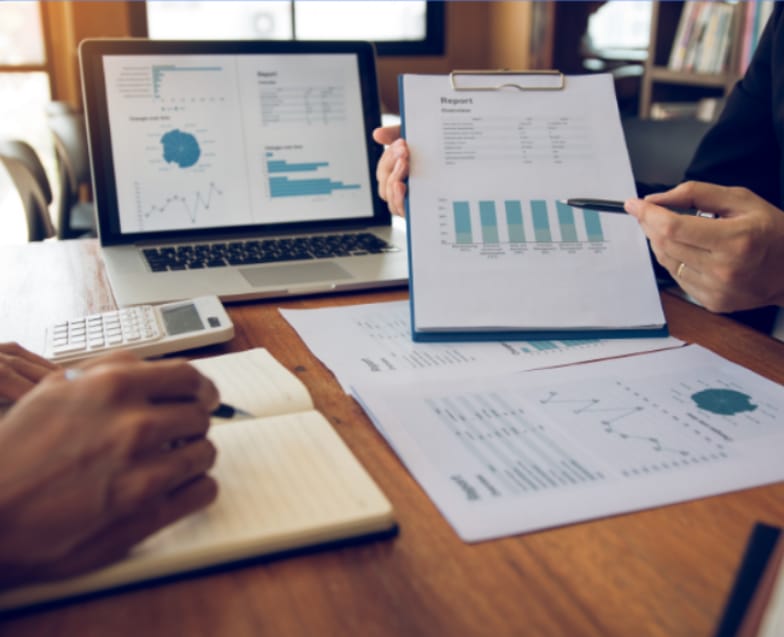 Financial planning charts and analysis on a desk
